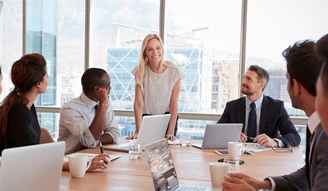 Board discussing cybersecurity at board room table