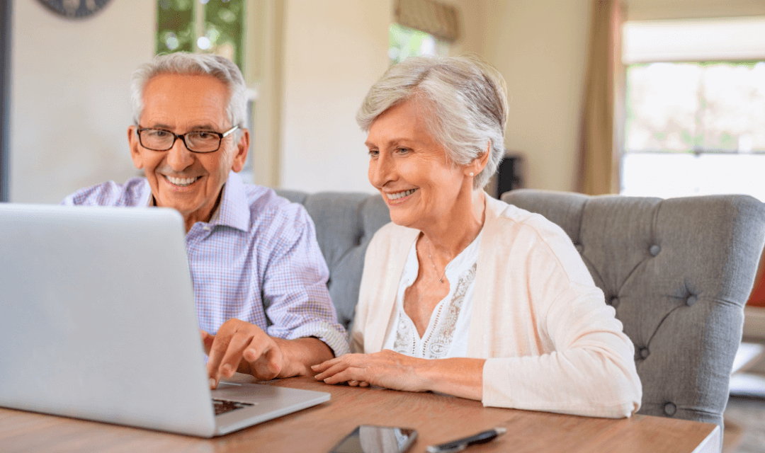 Couple looking at sensitive information on their laptop