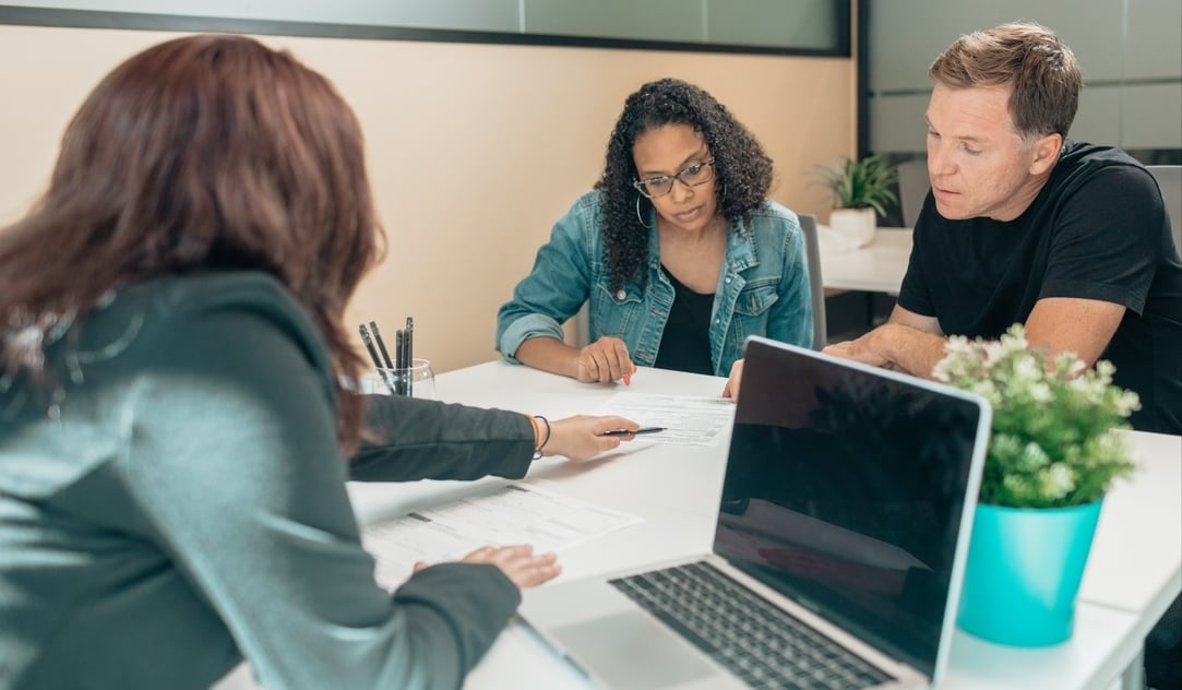 Financial adviser helping clients with their finances