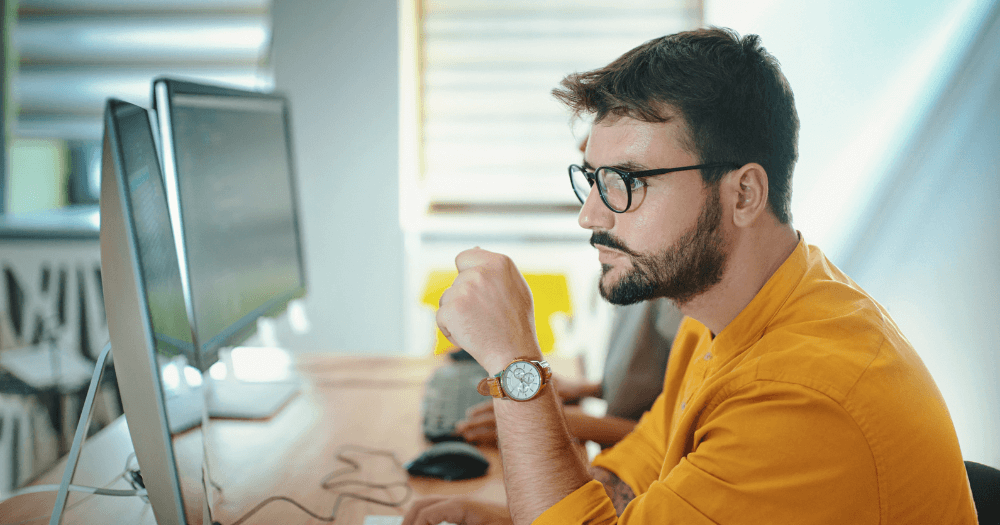 Developer on computer in office