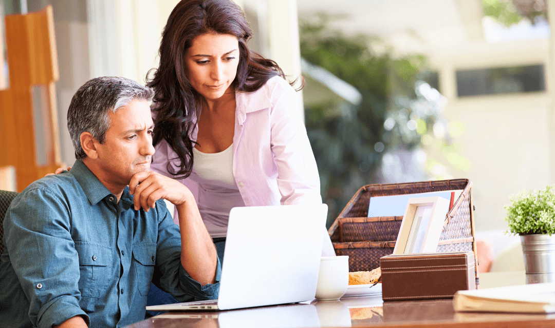 Man and woman sending document by email securely