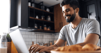 Man encrypting email in his kitchen using laptop.png