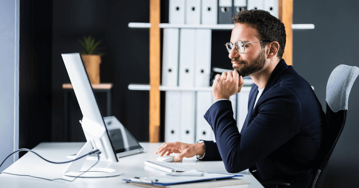 Man preventing data loss using desktop computer