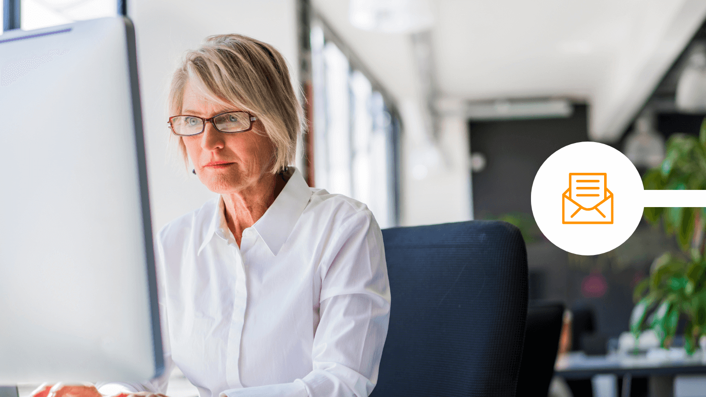 Woman using Outlook to send confidential data