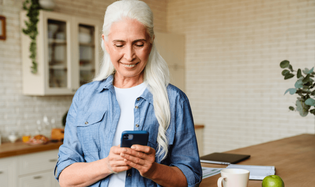 Woman using smartphone to send a document by email