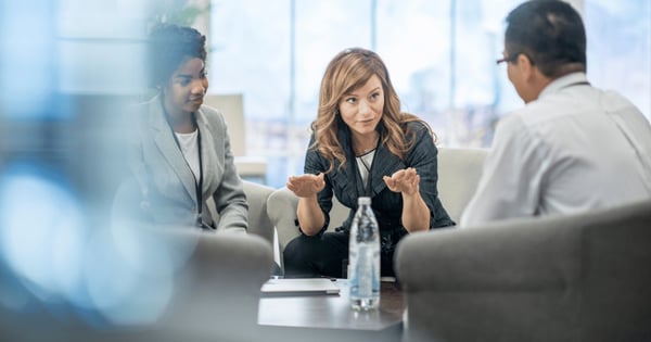 Female leader holding meeting about securing data in office