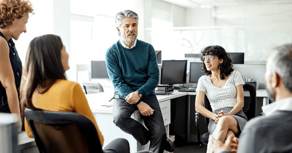 Male leader holding meeting about compliance with data ethics