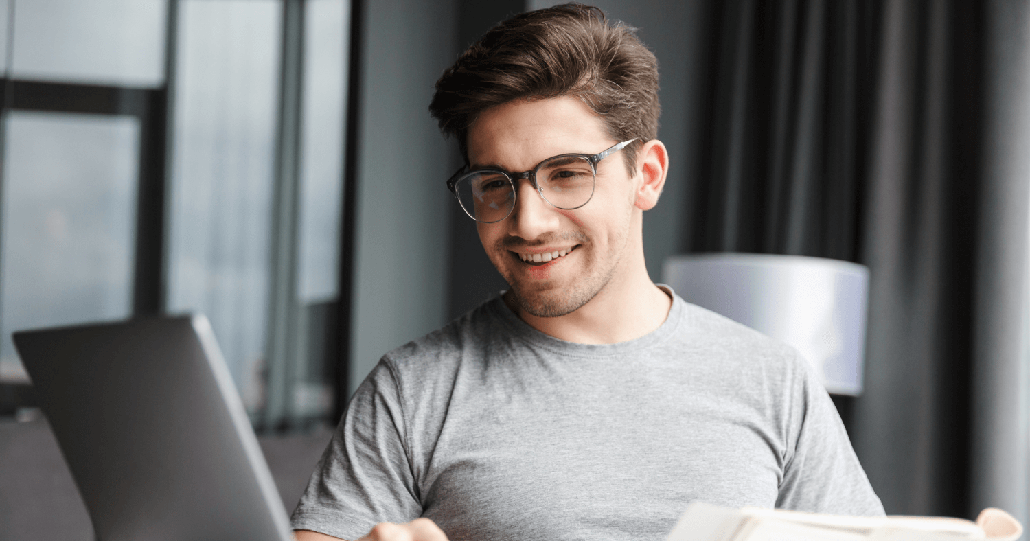 man reading an email in his hotel room