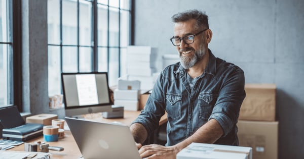 Man securing email at his work on laptop